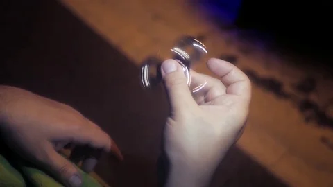 A brilliant spinner spinning in the hands of men. HD, 1920x1080. Slow motion Stock Footage 78227906