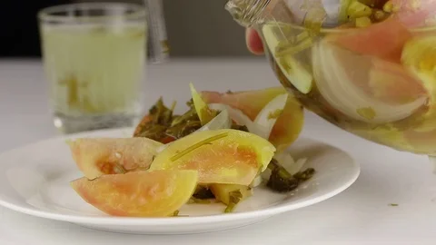 A brine from a jar with fermented tomatoes Stock Footage 121905154