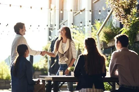 Bringing aboard a profitable partner. colleagues shaking hands during a meeting Stock Photos