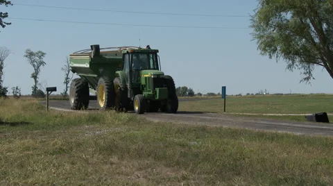 Bringing corn to the silos and unloading with line auger, 4K Stock Footage 68827123