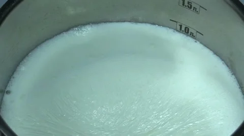 Bringing milk to the boil Stock Footage 57785068