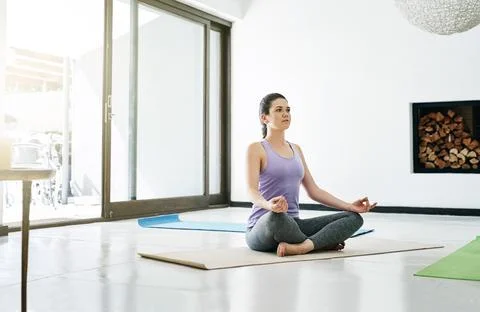 Bringing mind and body into complete alignment. an attractive young woman Stock Photos