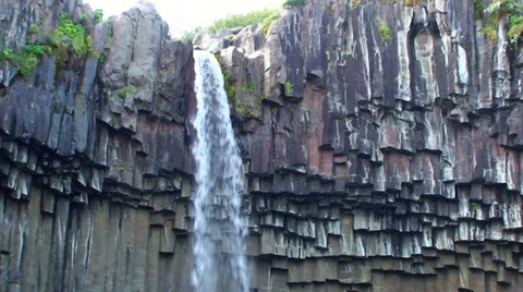 Brink of small waterfall on volcanic basalts Stock Footage 38020921