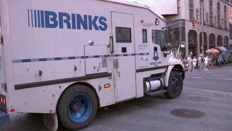 Brinks Security Truck driving through Times Square slow motion Stock Footage 94353806