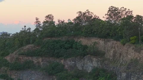 Brisbane CBD Skyline at Sunset Viewed Above Bushland Queensland Australia Stock Footage 338336736