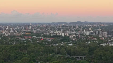 Brisbane CBD Skyline at Sunset Viewed Above Bushland Queensland Australia Stock Footage 338336849