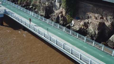 Brisbane - Elevated view of  Brisbane River Loop cycle path with people. 4K Stock Footage 88504376