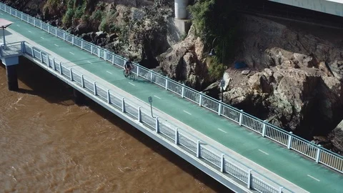 Brisbane -Elevated view of Brisbane River Loop cycle path with cyclists. 4K Stock Footage 89392394