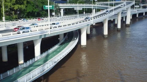 Brisbane - Elevated view of busy motorway and Brisbane River Loop cycle path. 4K Stock Footage 88503366