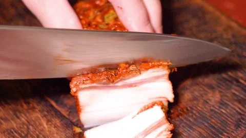 Brisket with spices, cut with a knife Stock Footage 249689794