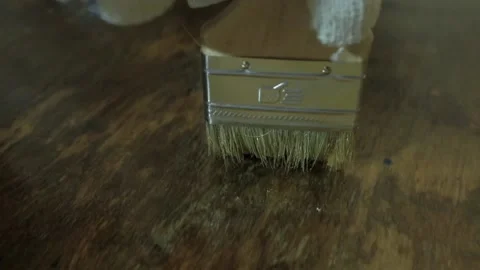 Bristle brush close up. Paintwork works. Hands in protective gloves Stock Footage 145322666