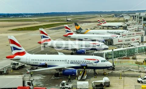 British Airways airliners at Gatwick Airport's South Terminal Stock Photos