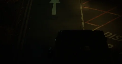 A British Ambulance Driving Down a Dark Road Leaving For An Emergency. Stock Footage 95091440