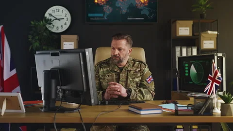 British armed forces officer working on computer, planning tactical operations Stock Footage 333306854