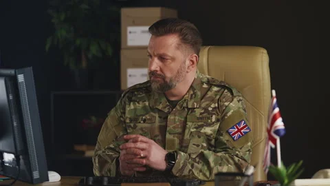 British army officer working on computer, planning military operations Stock Footage 335537481