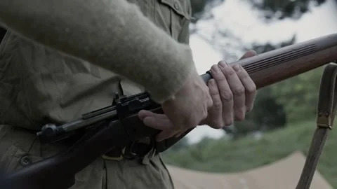 British Army soldier loading 5-round stripper clip into Lee Enfield Rifle Видео 286971369