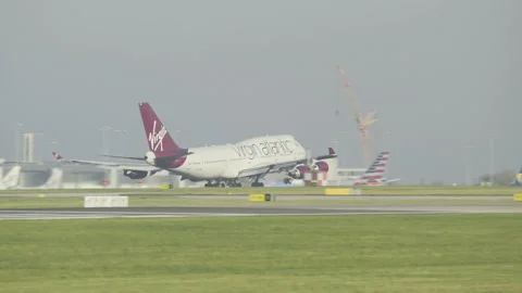 British Boeing 747 Jumbojet Airplane Take Off, Airport in Background Stock Footage 171498758