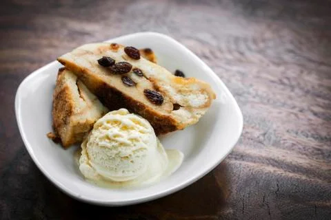 British bread pudding with vanilla ice cream dessert Stock Photos