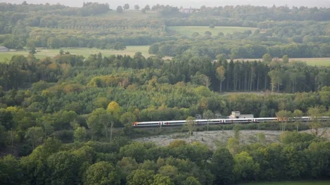 British countryside with train passing through aerial close up 库存影片 118262237