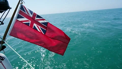 The British Ensign Flag on the back of a sailing yacht flapping in the wind. Stock Footage 312336470