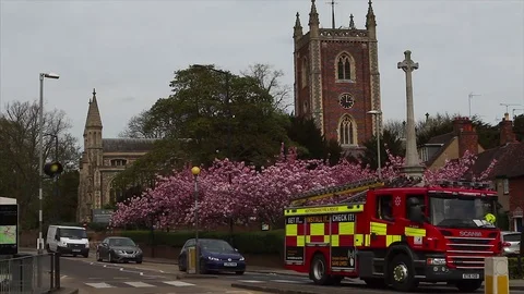 British Fire Engine drives passed English Church 스톡 동영상 74385274