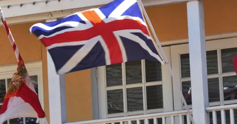 British flag flying on a flagpole on a building Stock Footage 152488097