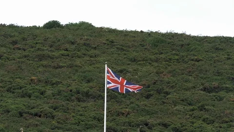 British Flag Flying In The Wind On Top Of A Building UK Stock Footage 92692748