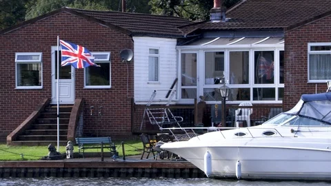 British Flag By the River Stock Footage 116896779