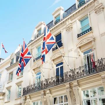 British flags flying on the balcony of a building in central London Stock Photos