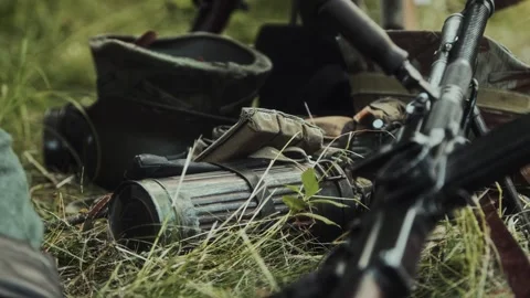 British light machine gun Bren Mk1 or similar ZB-26 ZB-30 resting on green grass Stock Footage 323366792