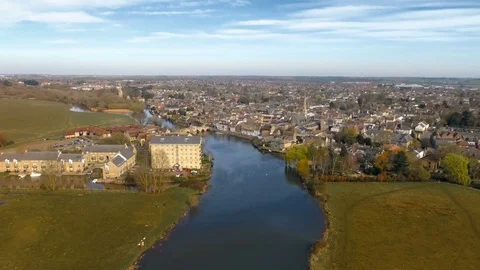 British market town by the river lift up revealing aerial shot Stock Footage