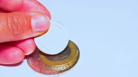 British pound coins put on a table on a white background Stock Footage 234142320