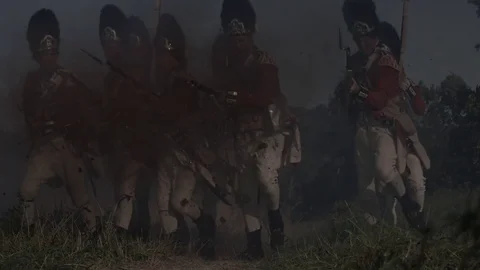 British Redcoats march through explosions in battle. Stock Footage 80266169