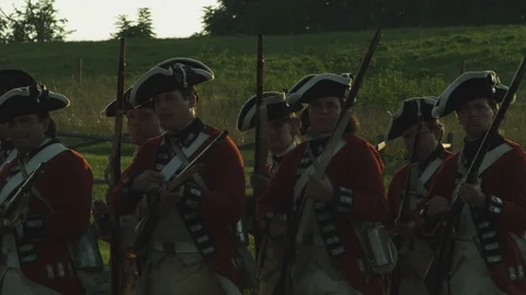 British Revolutiuonary War 18th Century Redcoats load muskets Stock Footage
