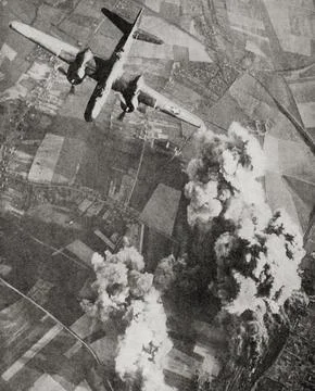 British R.A.F. planes dropping high-explosive bombs on a Nazi rail centre during Stock Photos