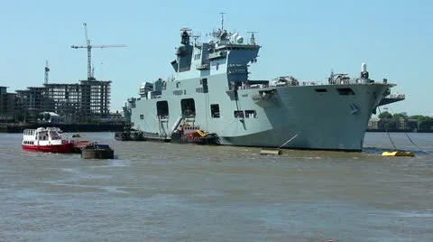 British Royal Navy aircraft carrier HMS Ocean moored in London Stock Footage