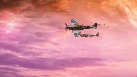 British Spitfires fly through a sunset sky in this motion graphic 動画素材 78928963