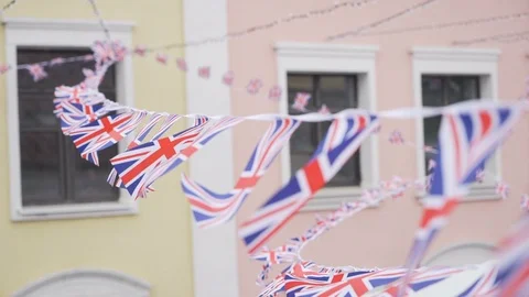 British Union Jack bunting flags against the wall of the house Video stock 125717064