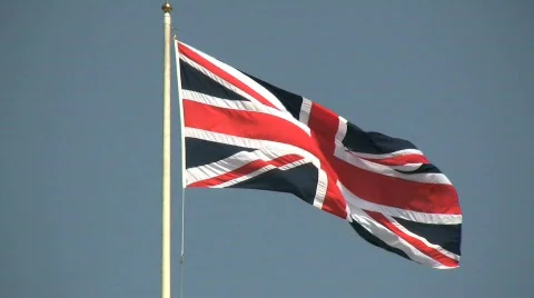 British Union Jack flag flying on a windy day in London England Stock Footage
