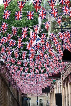 British Union Jack flag triangular hanging in preparation for a street party. Stock Photos
