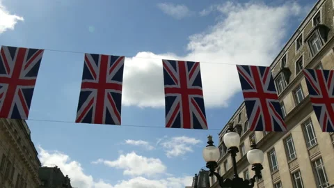 British Union Jack flags hanging above London Street upward POV tracking shot wi 動画素材 207508422