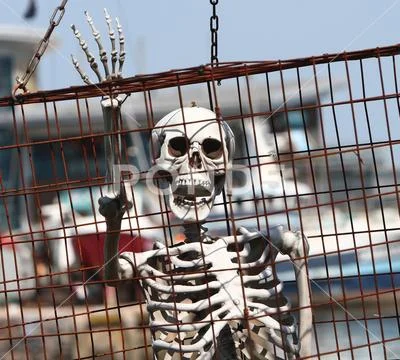 Brixham, Devon, England: A caged skeleton at the Pirate festival Stock Photos
