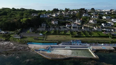 Brixham, Devon, England: DRONE AERIAL VIEWS: Shoalstone pool, coastline &amp; houses Stock Footage 241441637