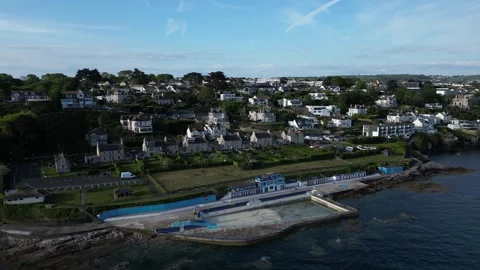 Brixham, Devon, England: DRONE AERIAL VIEWS: Shoalstone pool, coastline &amp; houses Stock Footage 241442812