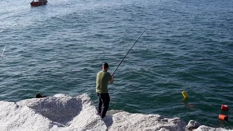 Brixham, devon. May 31, 2021. A happy men with two friends fishing in brixh.. Video stock 264352815