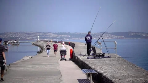 Brixham Harbour, Devon England. The breakwater and features Stock Footage 133359610