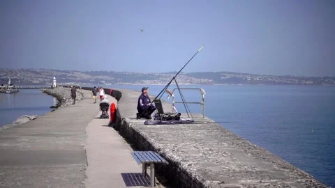 Brixham Harbour, Devon England. The breakwater and features Stock Footage 133359669