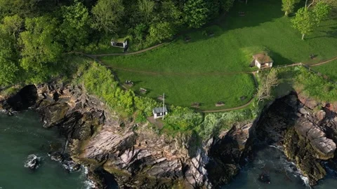 Brixham, South Devon, England: DRONE VIEWS: Battery Park and coastline Stock Footage 241142671