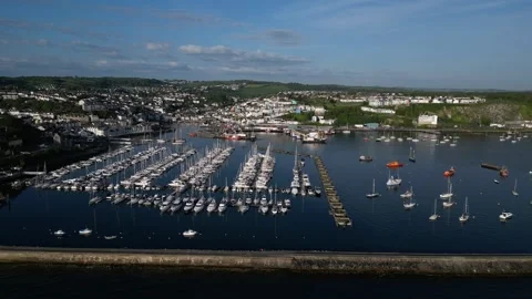 Brixham, South Devon, England: DRONE AERIAL VIEWS: The Outer Harbour and boats Stock Footage 241440578