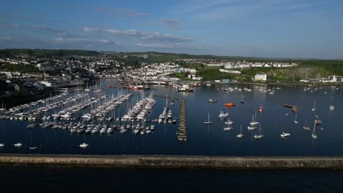 Brixham, South Devon, England: DRONE AERIAL VIEWS: The Outer Harbour and boats Stock Footage 241440650